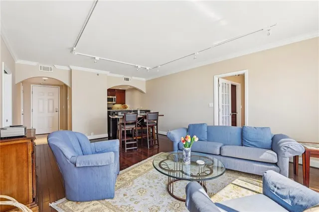 a living room with furniture dining table and a couch