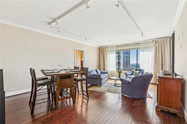 a view of a dining room with furniture window and wooden floor