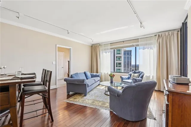 a living room with fireplace furniture and a window