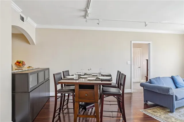 a view of a dining room with furniture and wooden floor