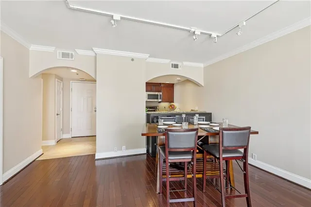 a view of a dining room with furniture and wooden floor
