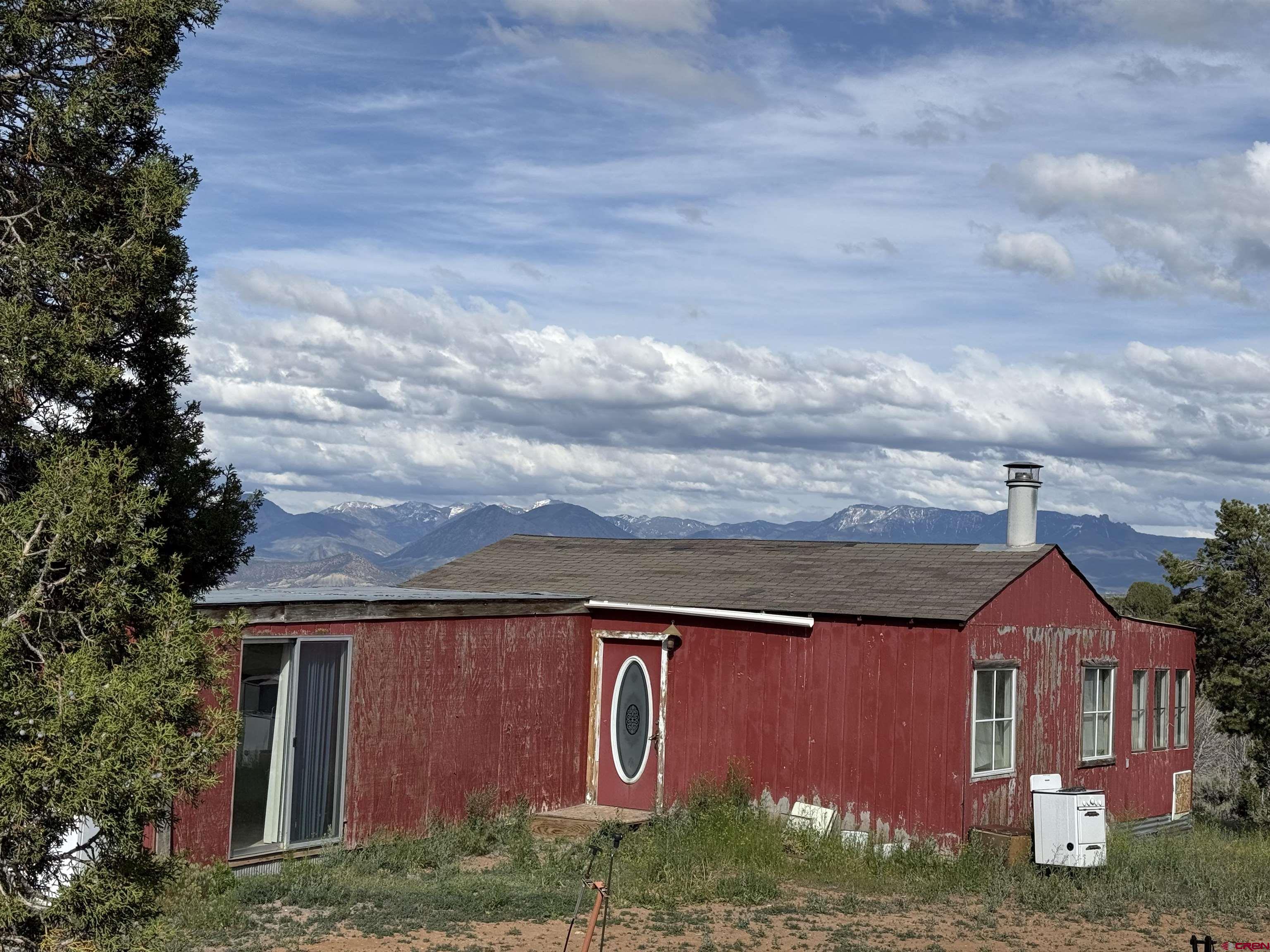 32310 B50 Road Crawford, CO 81415 - Photo 44 of 45 a front view of a house with garden