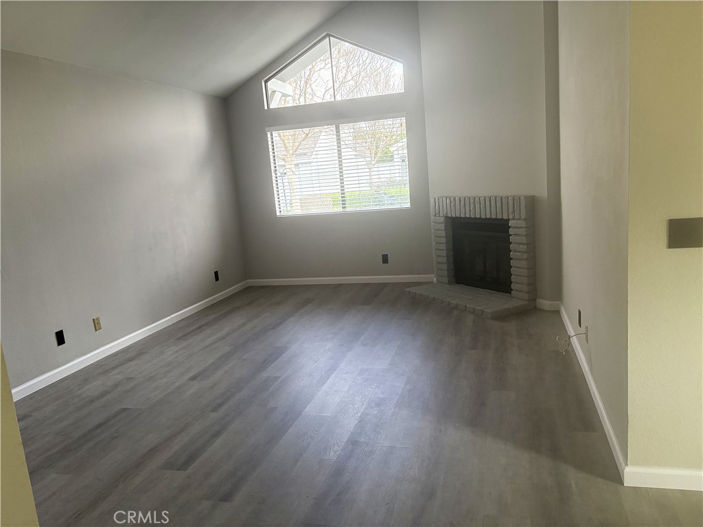 16 Amberleaf Irvine, CA 92614 - Photo 6 of 18 Beautiful laminate flooring--so easy to care for. Fireplace is just for show.