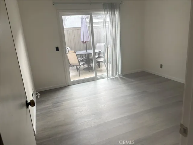 a view of a patio with couches and potted plants