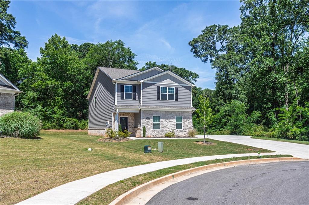 635 Meadows Farm Way Monroe, GA 30655 - Photo 3 of 36 a front view of a house with a yard