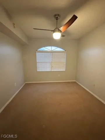 an empty room with a empty space and windows