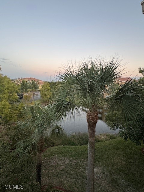15605 Ocean Walk Circle, Unit 301 Fort Myers, FL 33908 - Photo 15 of 28 a view of a yard with palm trees