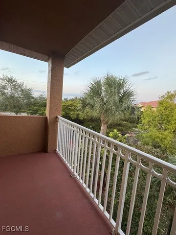 a view of balcony with furniture