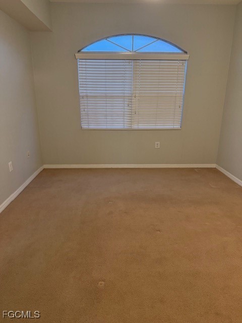 15605 Ocean Walk Circle, Unit 301 Fort Myers, FL 33908 - Photo 24 of 28 an empty room with a window