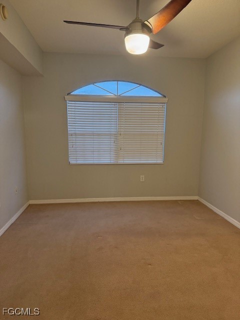 15605 Ocean Walk Circle, Unit 301 Fort Myers, FL 33908 - Photo 25 of 28 an empty room with a fan