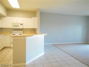 15605 Ocean Walk Circle, Unit 301 Fort Myers, FL 33908 - Photo 7 of 28 a utility room with dryer and washer