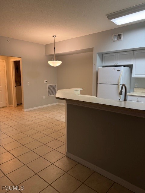 15605 Ocean Walk Circle, Unit 301 Fort Myers, FL 33908 - Photo 10 of 28 a kitchen with a sink and cabinets