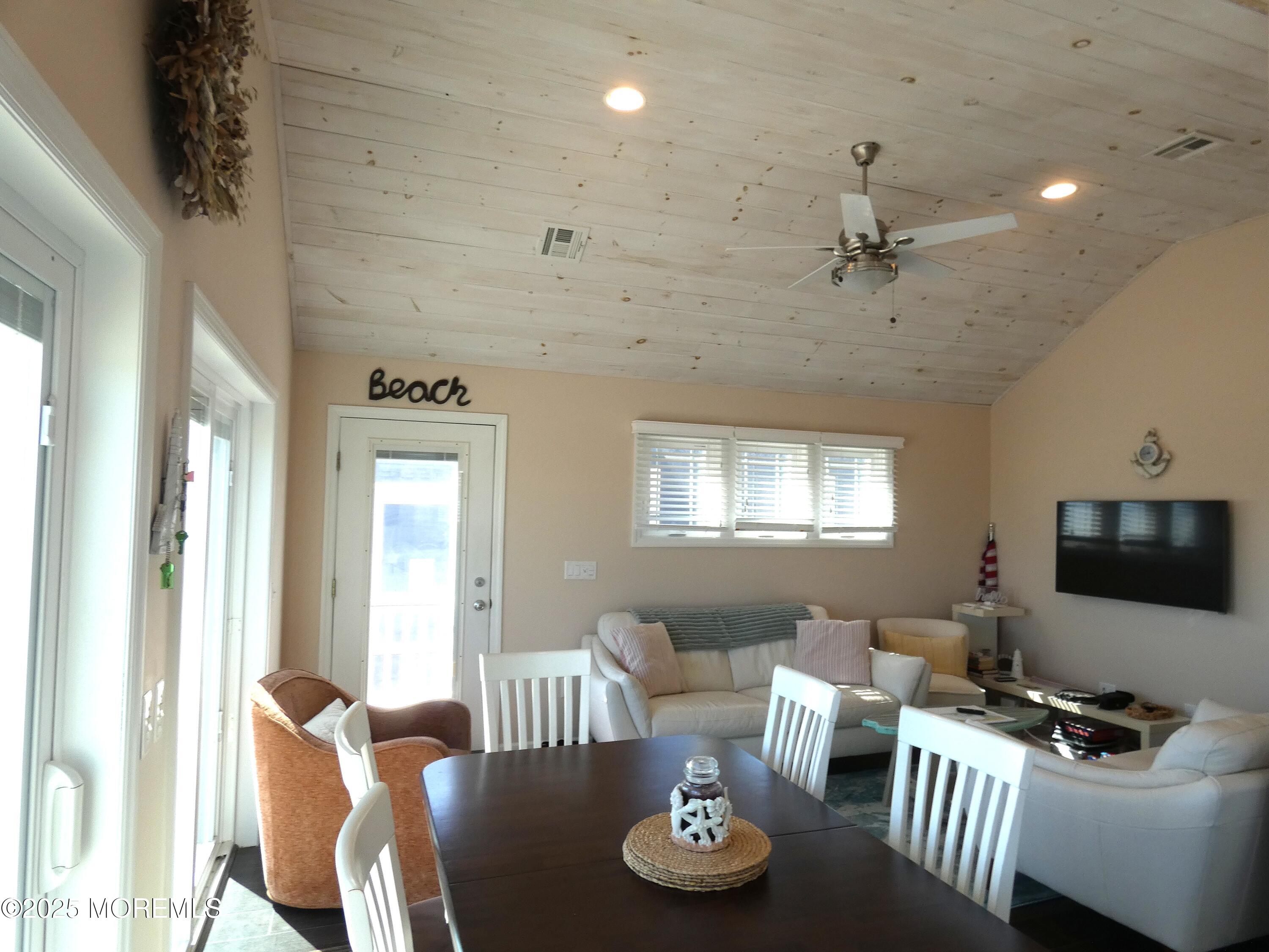 3420 Seaview Road Lavallette, NJ 08735 - Photo 13 of 44 a living room with furniture and a flat screen tv