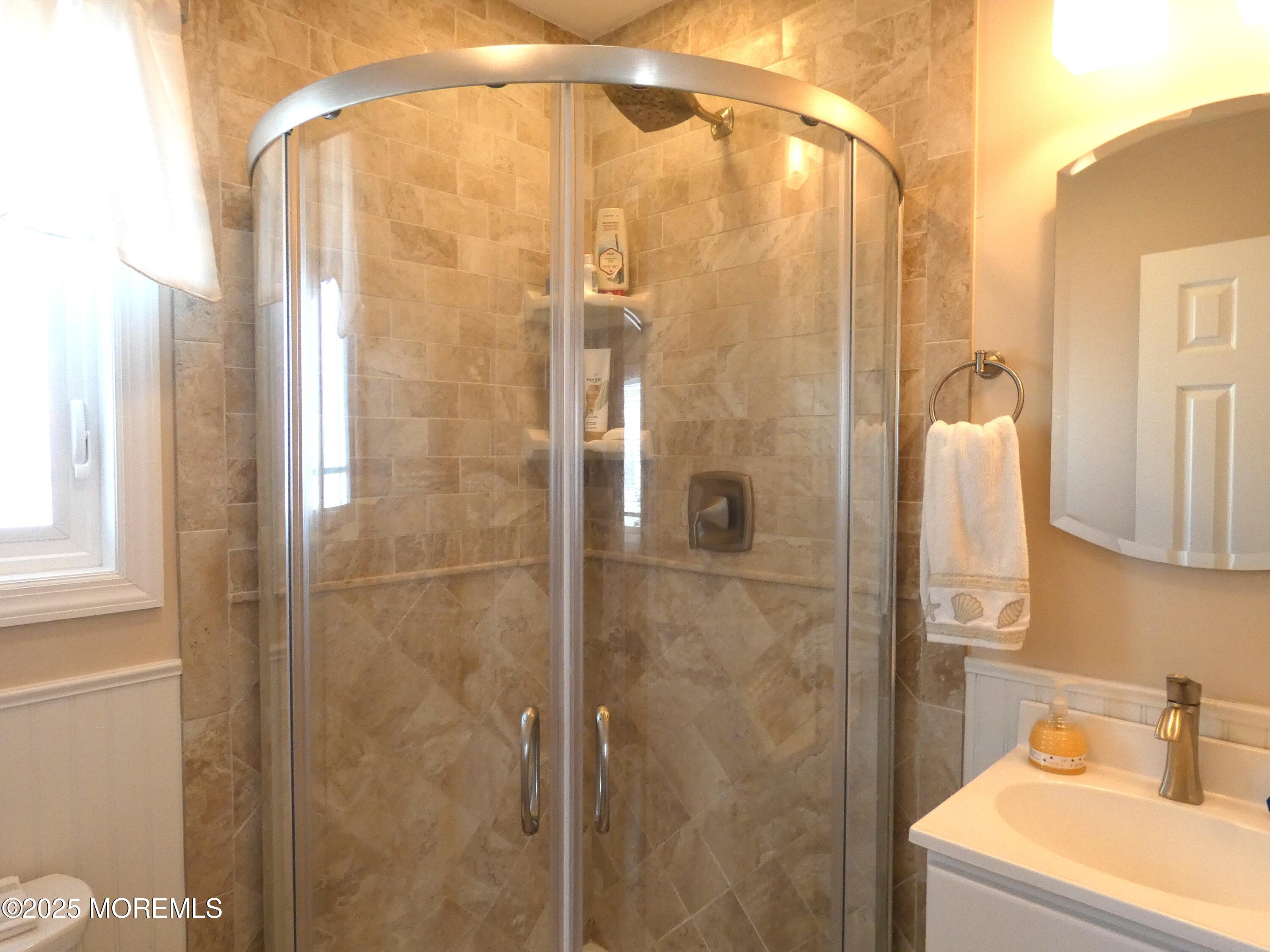 3420 Seaview Road Lavallette, NJ 08735 - Photo 18 of 44 a bathroom with a shower and a sink