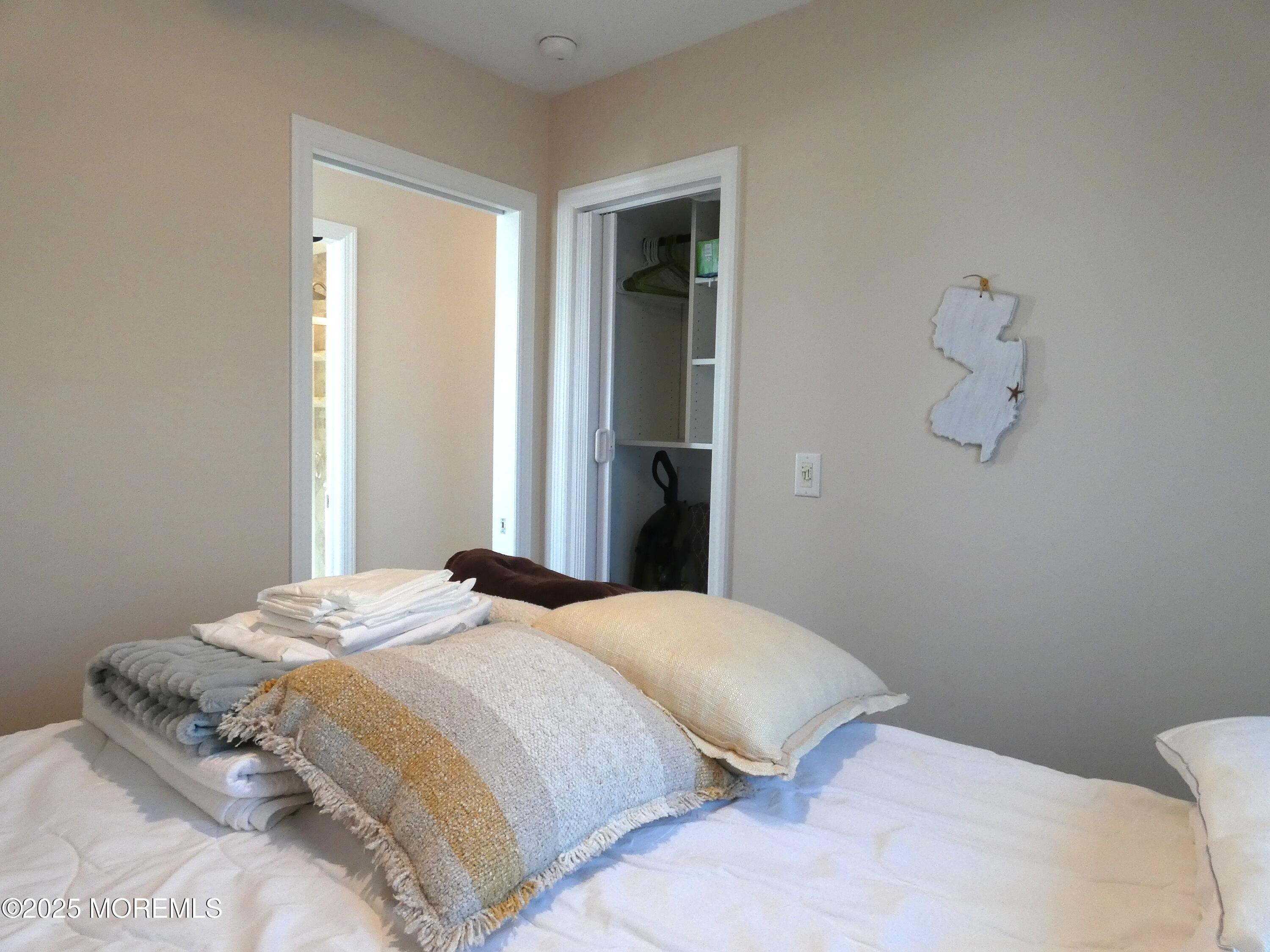 3420 Seaview Road Lavallette, NJ 08735 - Photo 23 of 44 a bedroom with a bed and a window
