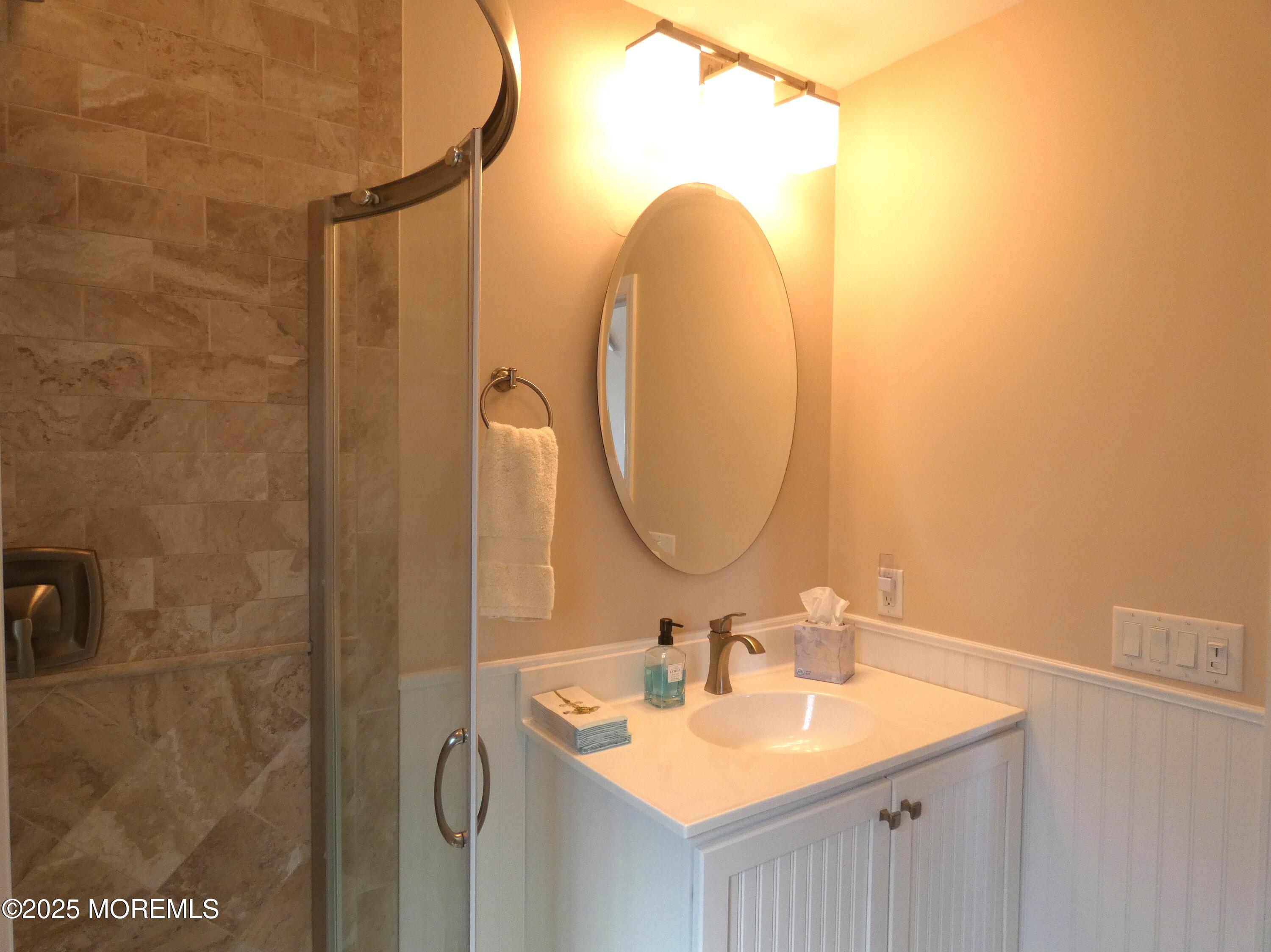 3420 Seaview Road Lavallette, NJ 08735 - Photo 25 of 44 a bathroom with a sink and a mirror