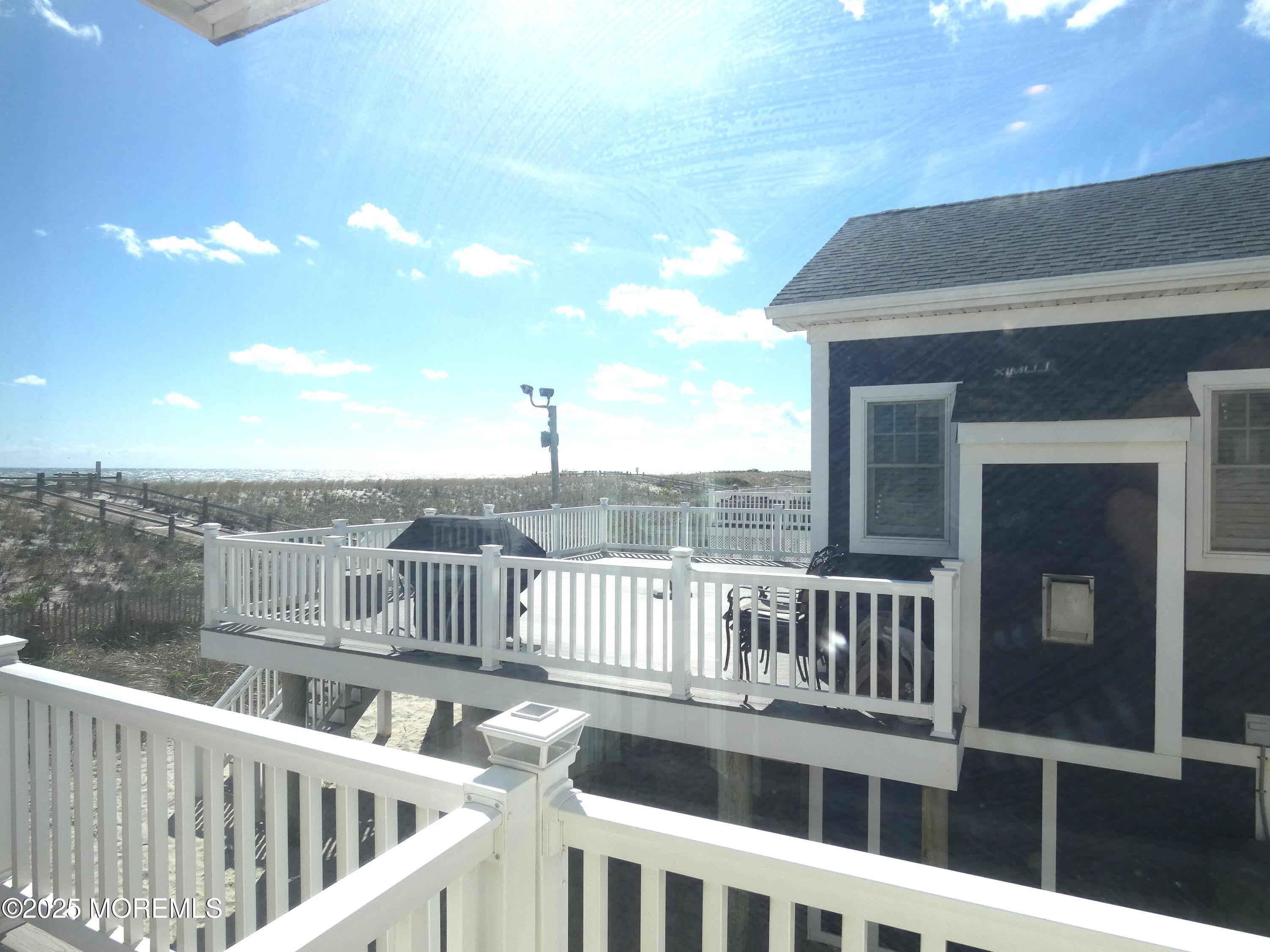 3420 Seaview Road Lavallette, NJ 08735 - Photo 30 of 44 a view of a balcony with furniture