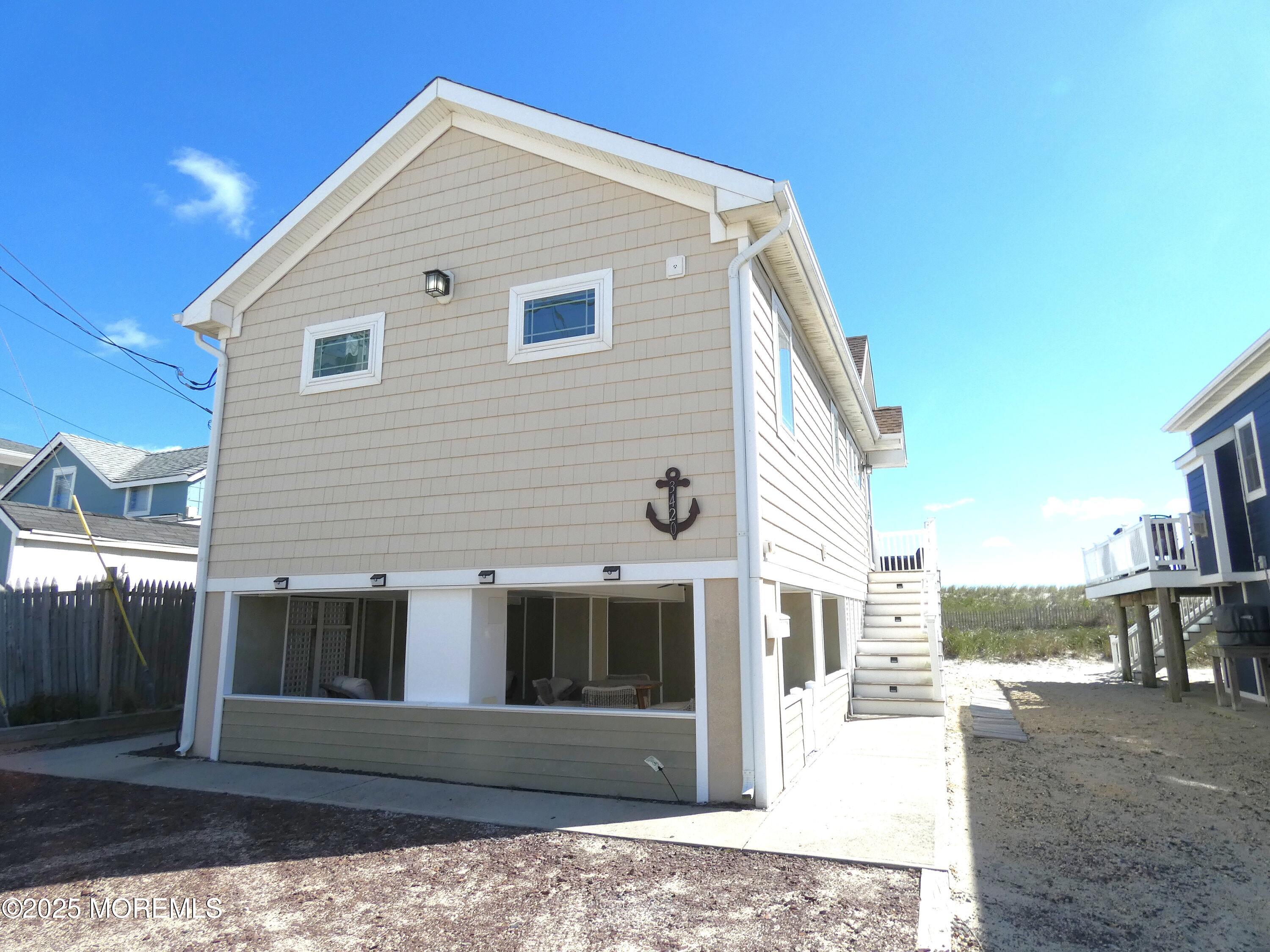 3420 Seaview Road Lavallette, NJ 08735 - Photo 3 of 44 a view of a house with a house