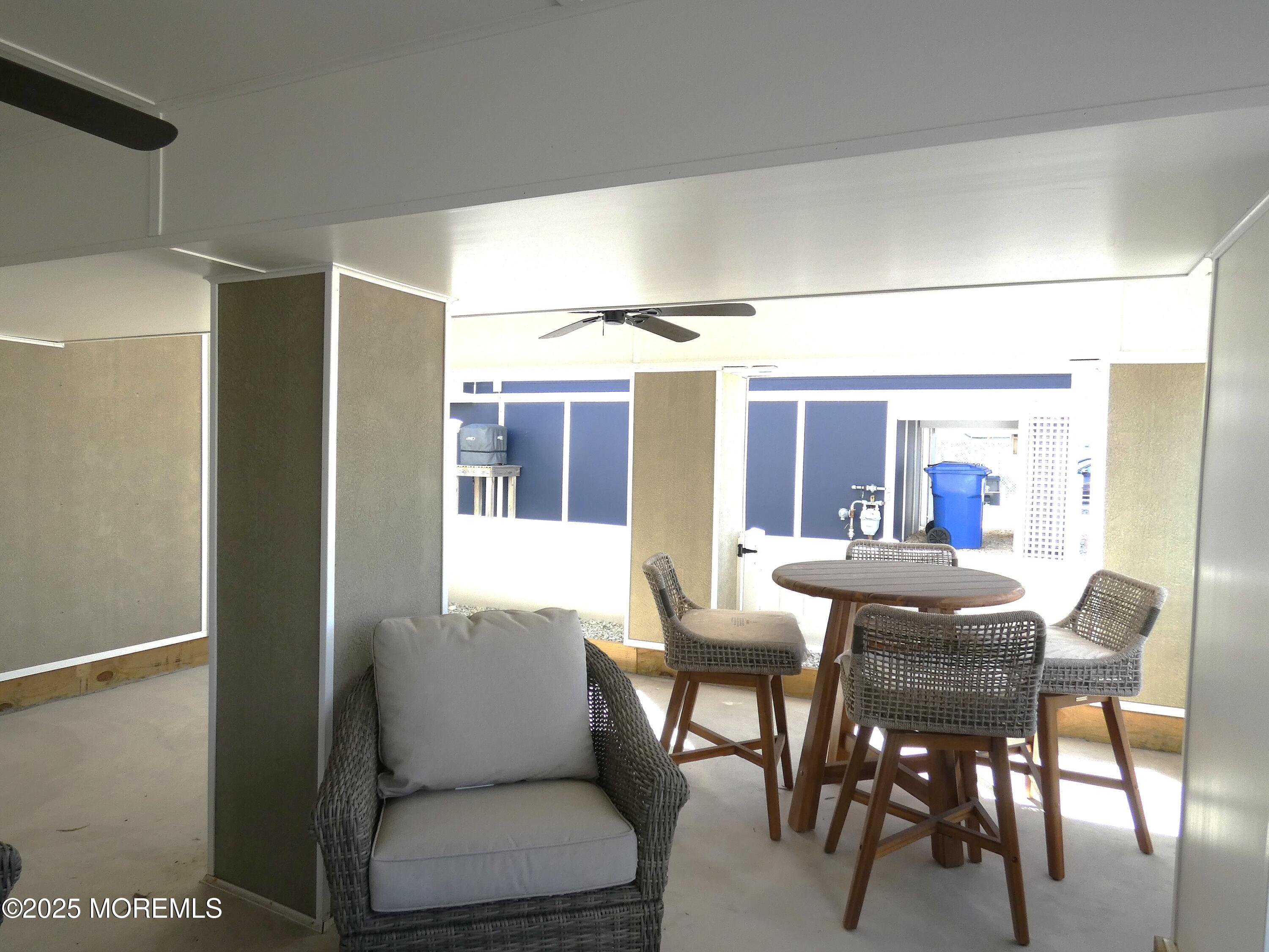 3420 Seaview Road Lavallette, NJ 08735 - Photo 34 of 44 a dining room with furniture and a large window