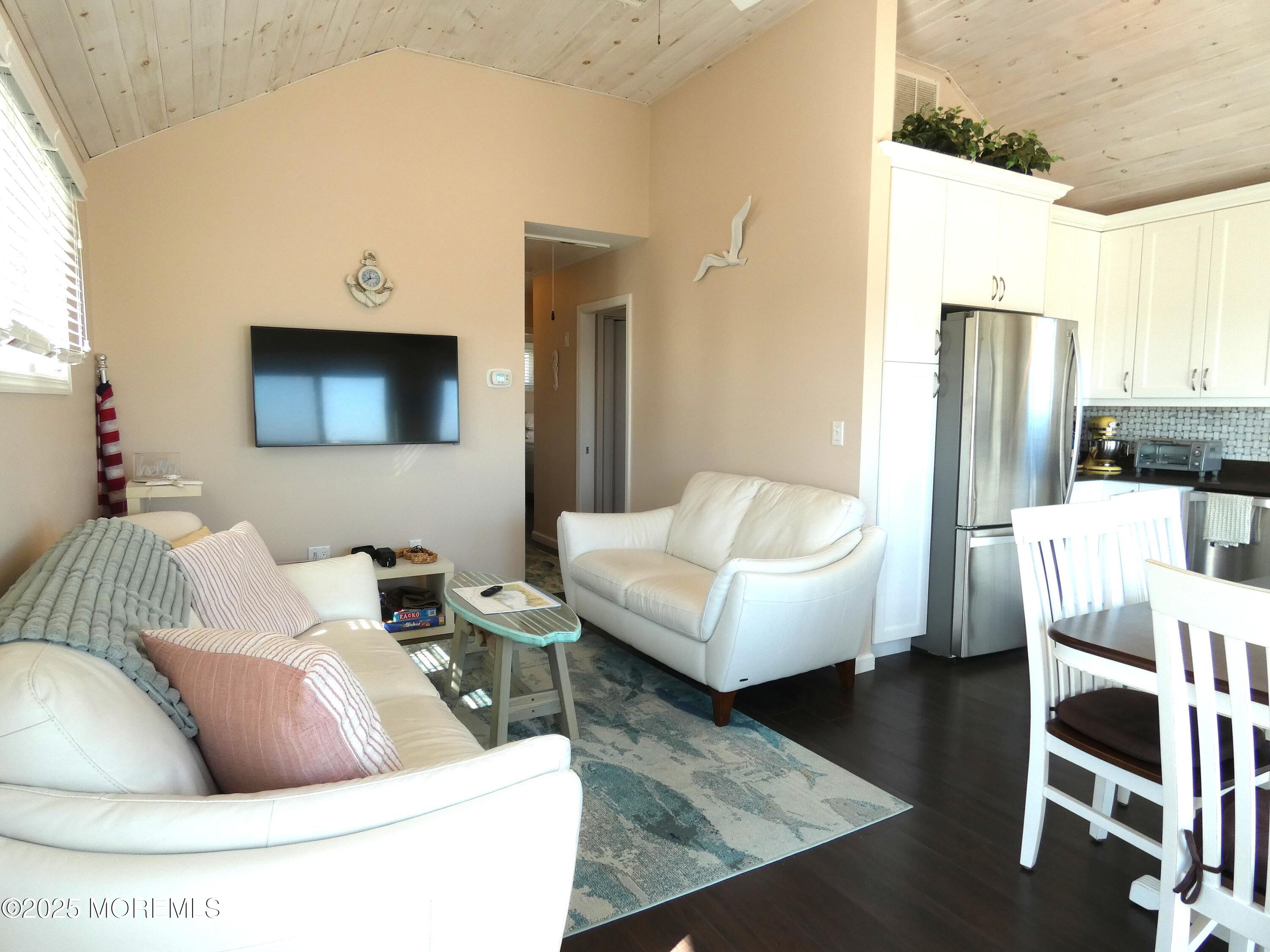 3420 Seaview Road Lavallette, NJ 08735 - Photo 6 of 44 a living room with furniture and a flat screen tv