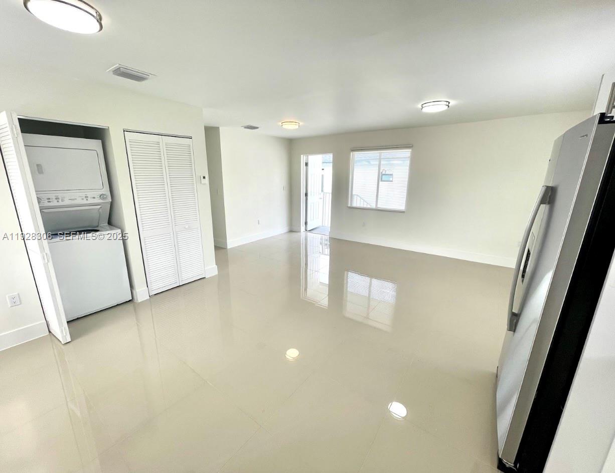 1766 Northwest 68th Terrace, Unit A Miami, FL 33147 - Photo 2 of 10 a view of a hallway to rooms