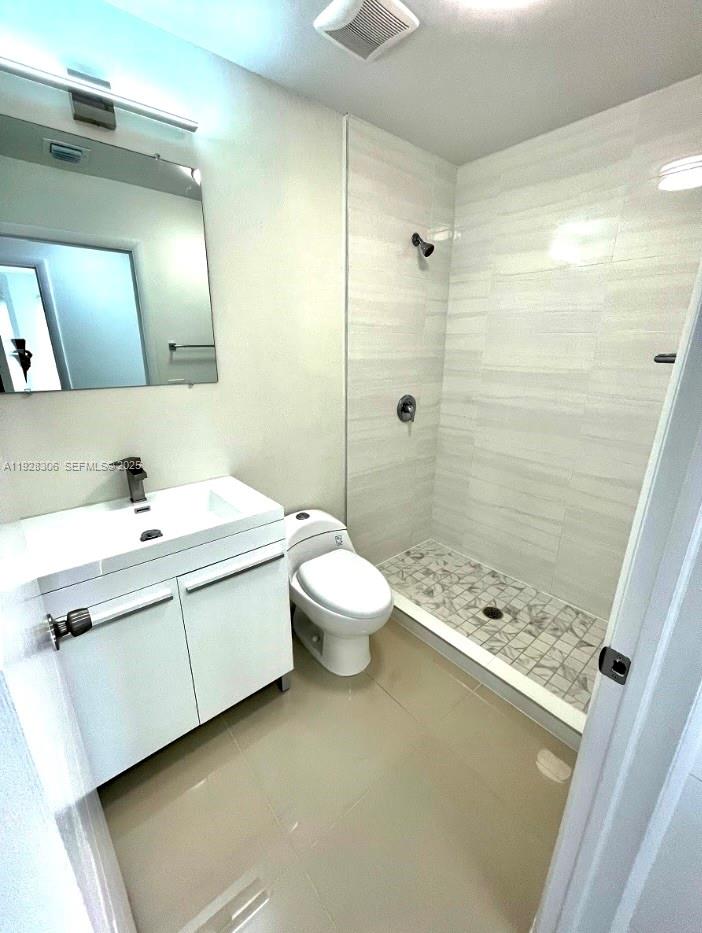 1766 Northwest 68th Terrace, Unit A Miami, FL 33147 - Photo 4 of 10 a bathroom with a sink toilet and shower