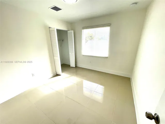 a bathroom with a sink mirror toilet and bathtub