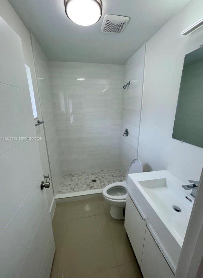 1766 Northwest 68th Terrace, Unit A Miami, FL 33147 - Photo 9 of 10 a bathroom with a sink mirror toilet and bathtub