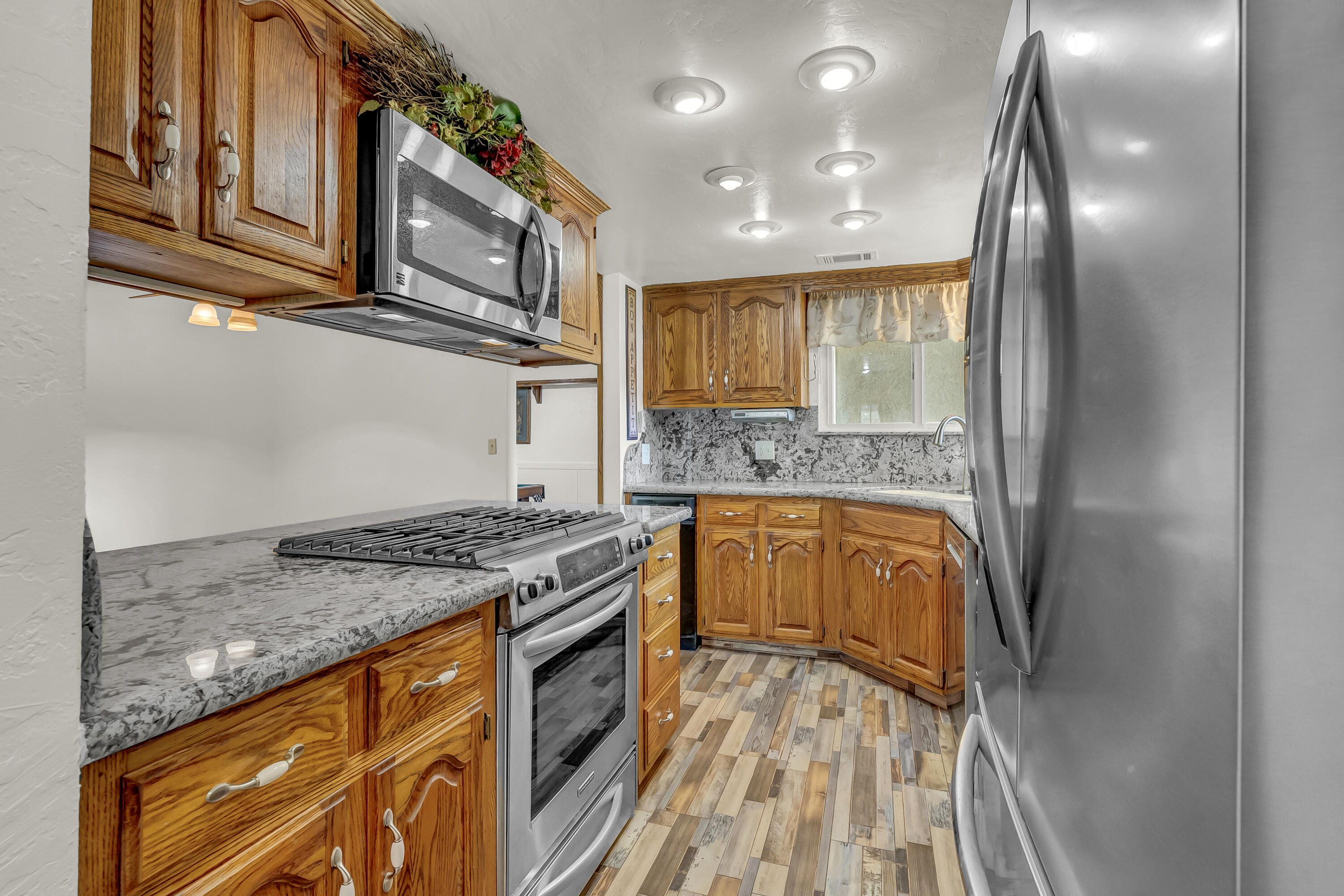 18002 320th Road Springville, CA 93265 - Photo 29 of 56 a kitchen with stainless steel appliances granite countertop a stove and a sink