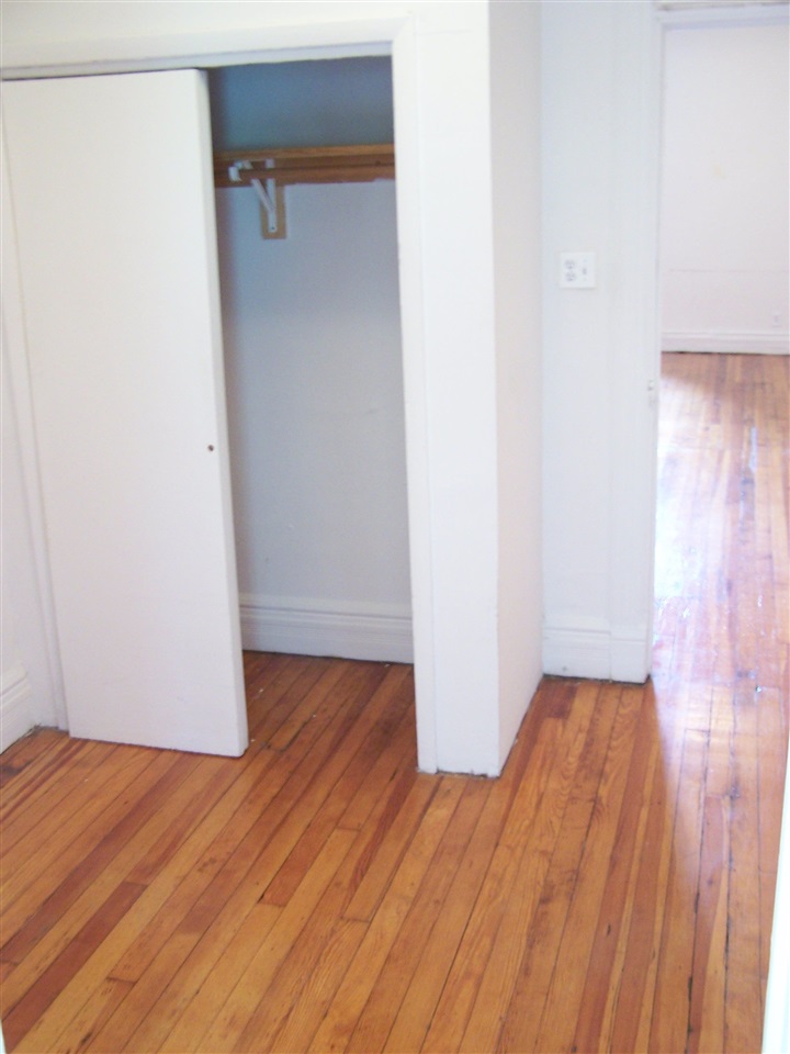 112 14th Street, Unit 3 Hoboken, NJ 07030 - Photo 5 of 10 a view of a room with wooden floor