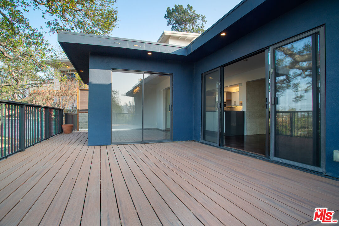 1925 Walcott Way Los Angeles, CA 90039 - Photo 11 of 27 a view of backyard with a deck and wooden floor