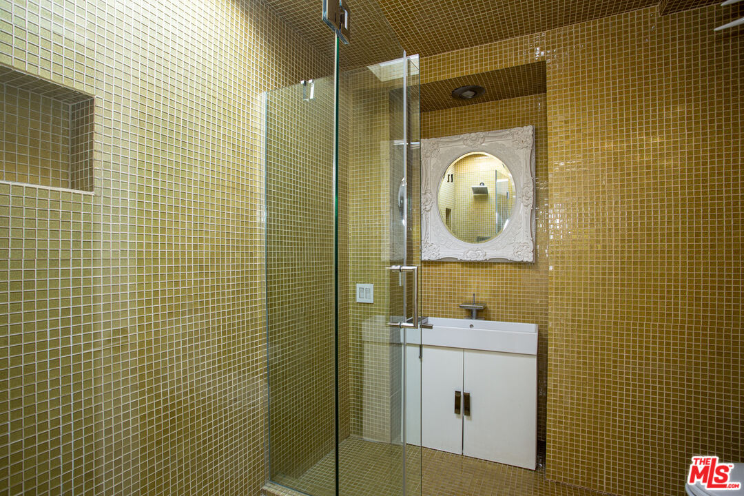 1925 Walcott Way Los Angeles, CA 90039 - Photo 22 of 27 a bathroom with a shower a sink and mirror