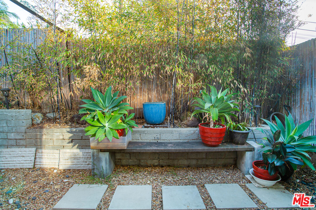1925 Walcott Way Los Angeles, CA 90039 - Photo 23 of 27 a potted plant sitting in front of a house