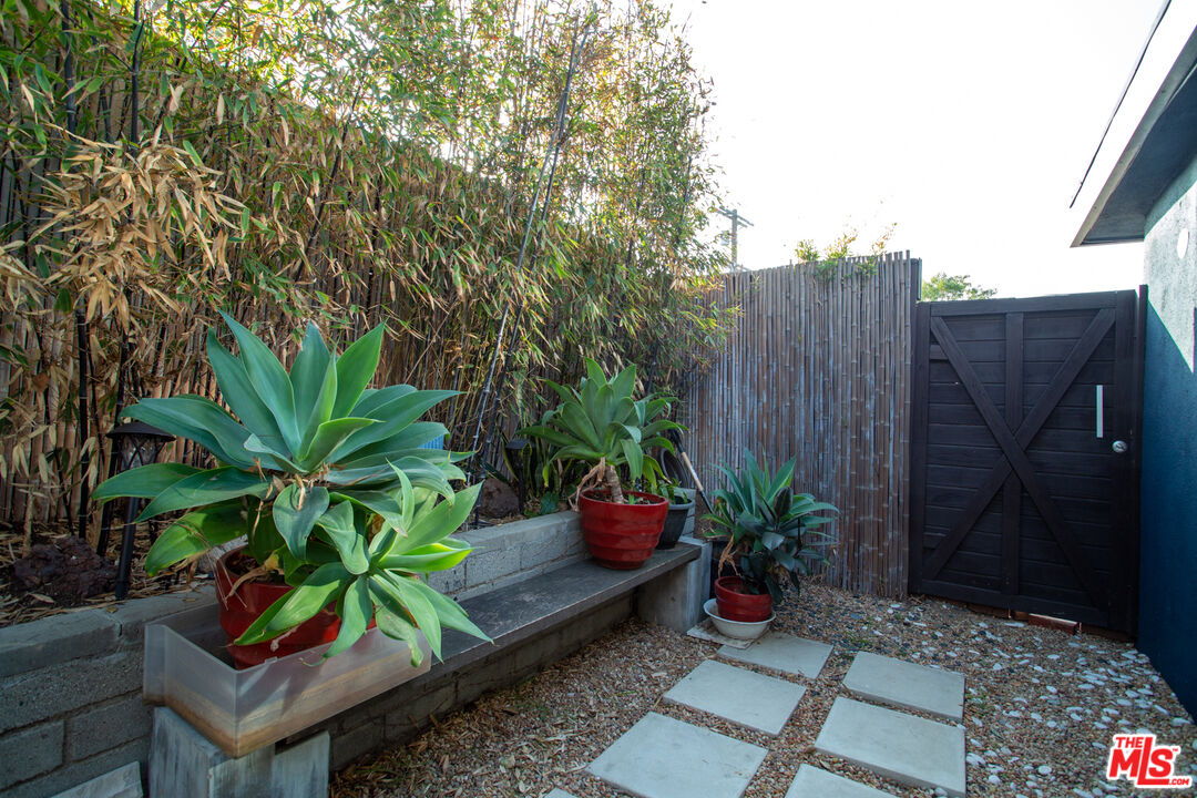 1925 Walcott Way Los Angeles, CA 90039 - Photo 24 of 27 a potted plant sitting in front of a house