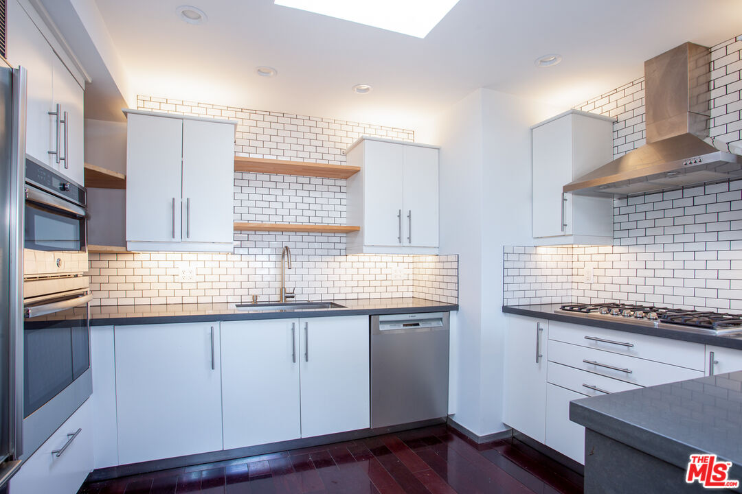 1925 Walcott Way Los Angeles, CA 90039 - Photo 8 of 27 a kitchen with granite countertop a sink and a stove