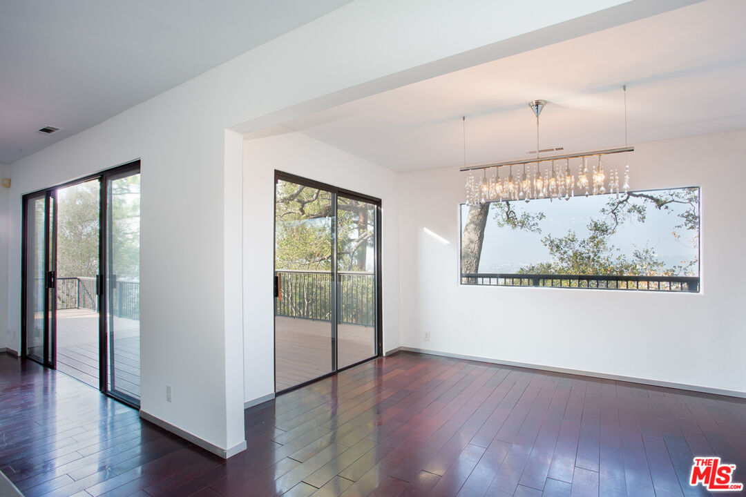1925 Walcott Way Los Angeles, CA 90039 - Photo 10 of 27 wooden floor in an empty room with a window