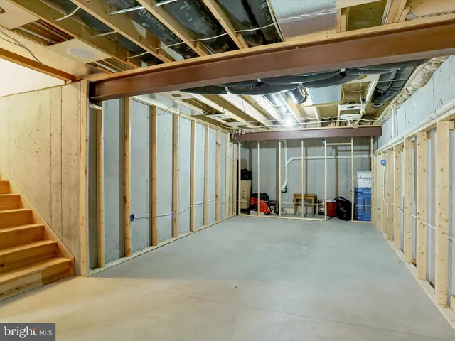 a view of a room with wooden walls and windows