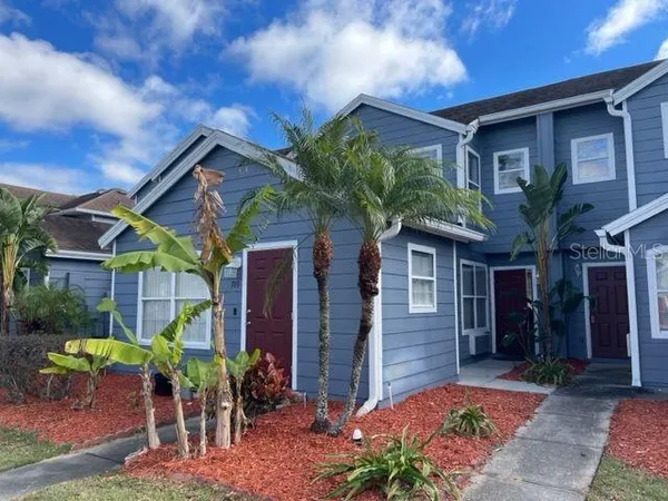 a front view of house with yard and seating space