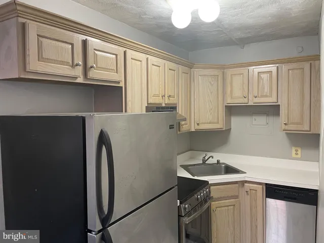 a bathroom with a sink a toilet a shower and a mirror