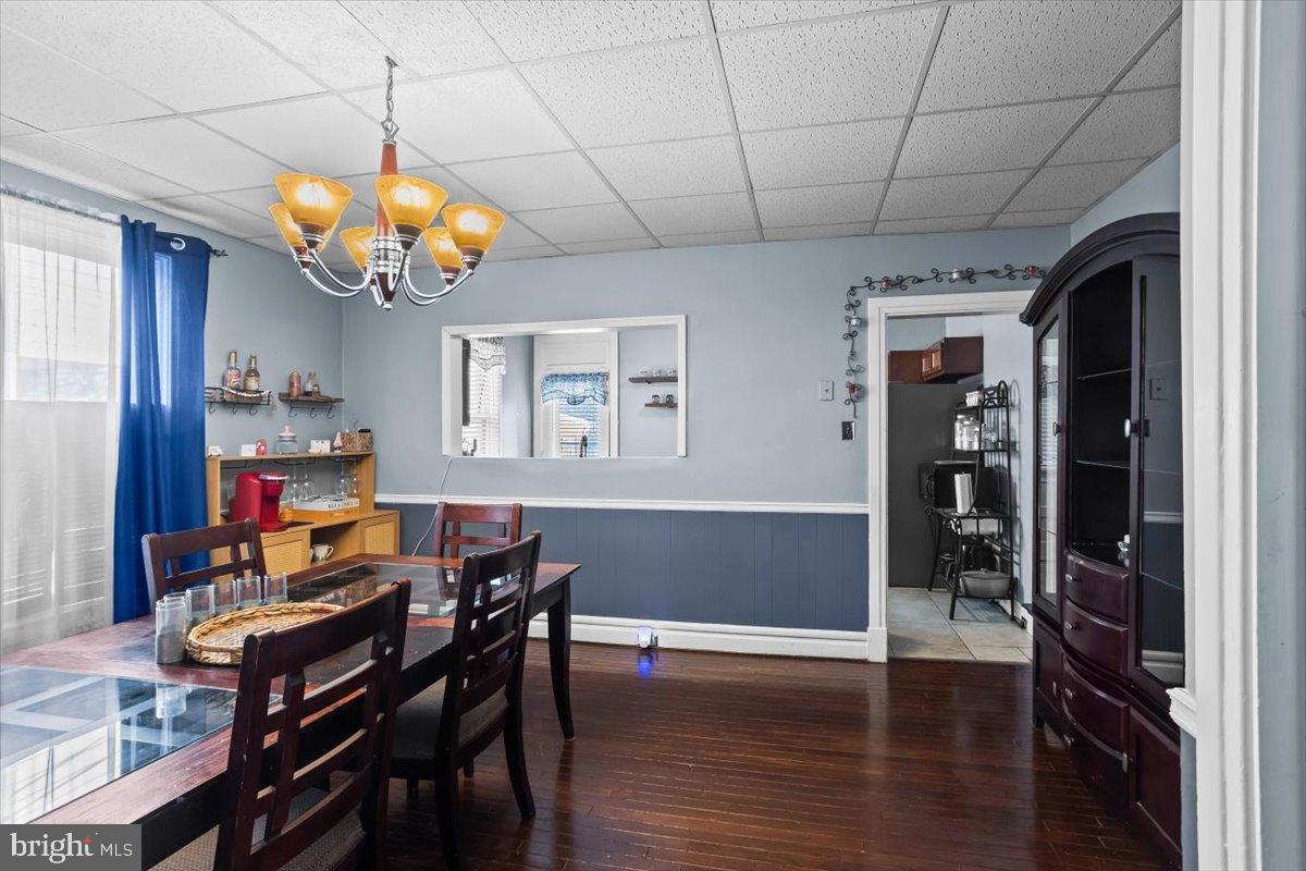 128 East Ross Street Lancaster, PA 17602 - Photo 13 of 36 a view of a dining room with furniture wooden floor and chandelier