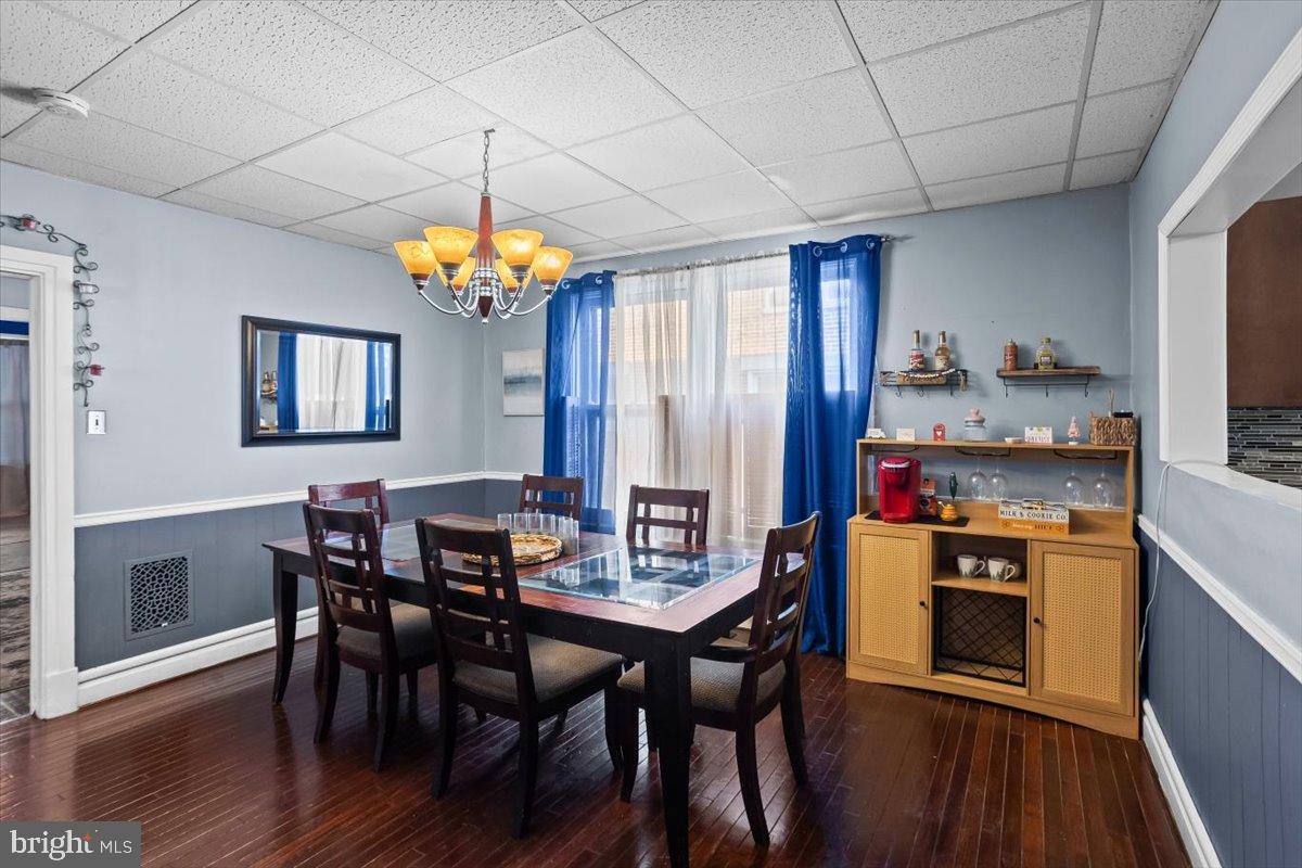 128 East Ross Street Lancaster, PA 17602 - Photo 14 of 36 a view of a dining room with furniture wooden floor and chandelier