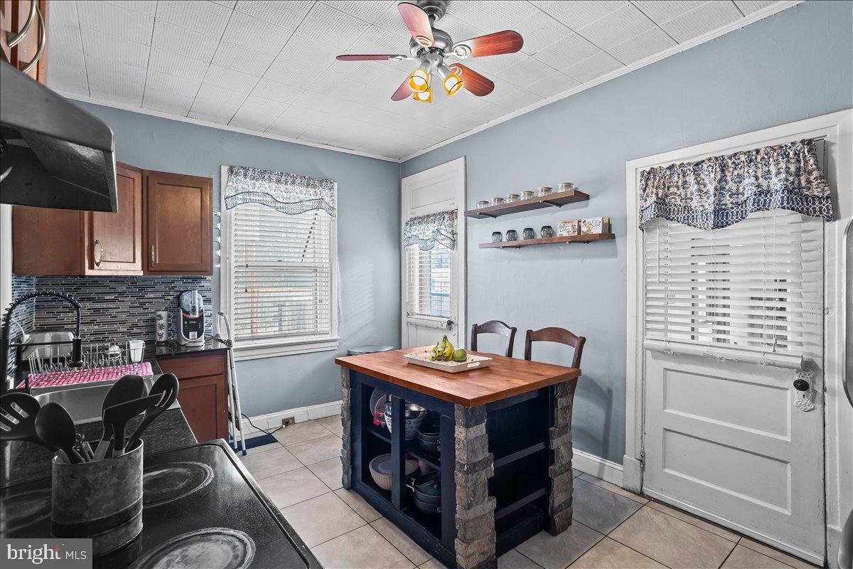 128 East Ross Street Lancaster, PA 17602 - Photo 16 of 36 a kitchen with stainless steel appliances a stove a sink and a refrigerator