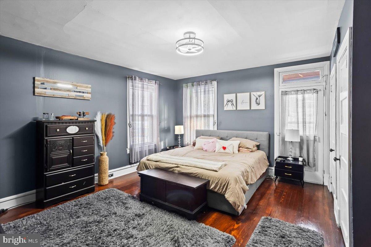 128 East Ross Street Lancaster, PA 17602 - Photo 18 of 36 a bedroom with a bed and wooden floor