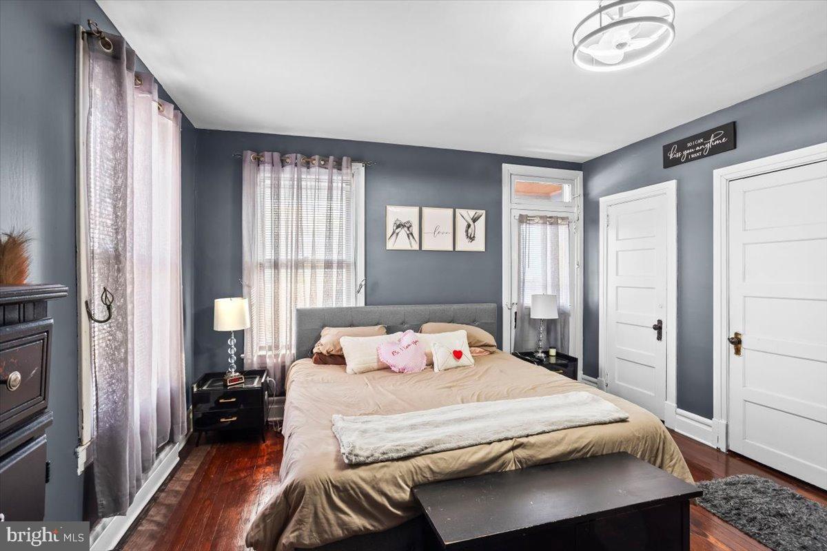 128 East Ross Street Lancaster, PA 17602 - Photo 19 of 36 a bedroom with a bed and wooden floor