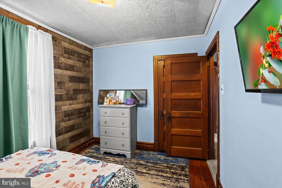 128 East Ross Street Lancaster, PA 17602 - Photo 24 of 36 a bedroom with a bed and a cabinets