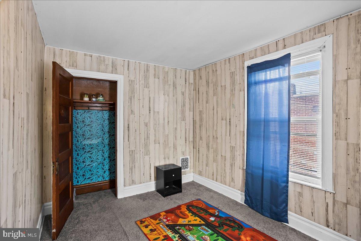 128 East Ross Street Lancaster, PA 17602 - Photo 28 of 36 a bedroom with a bed and a window