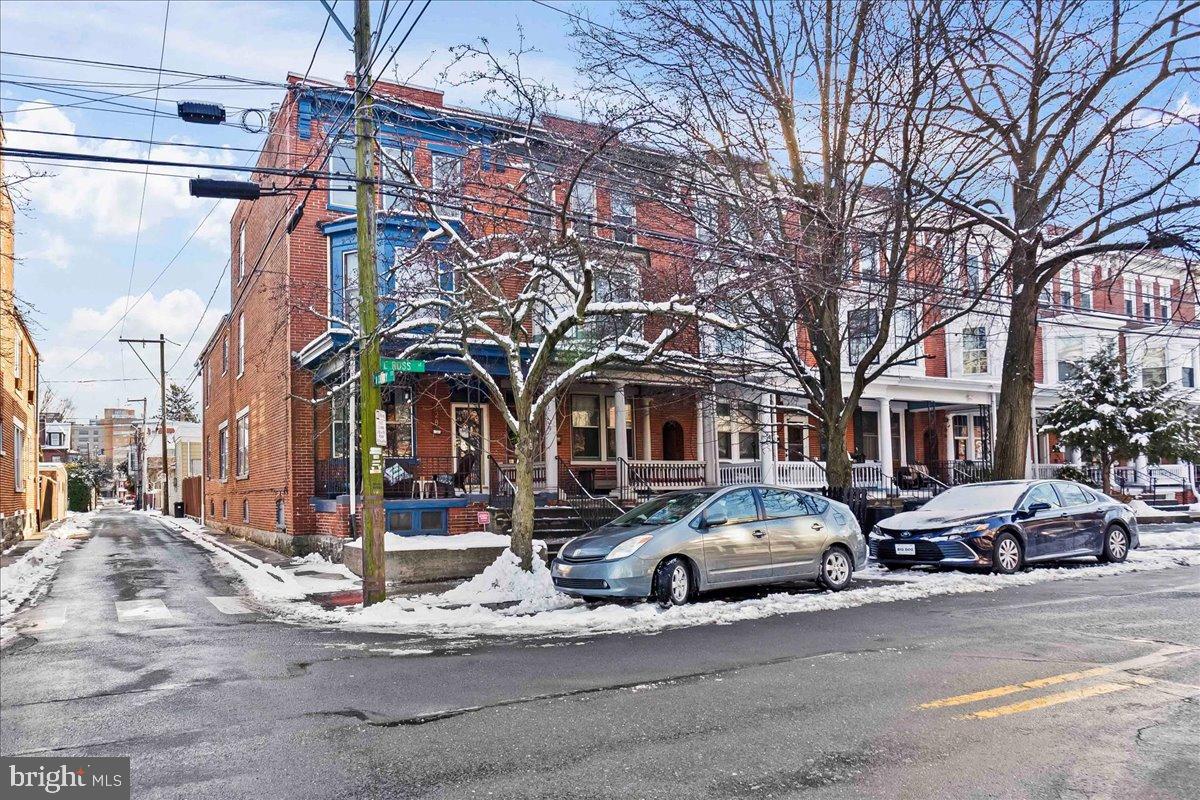 128 East Ross Street Lancaster, PA 17602 - Photo 3 of 36 a front view of a building with lot of cars and trees