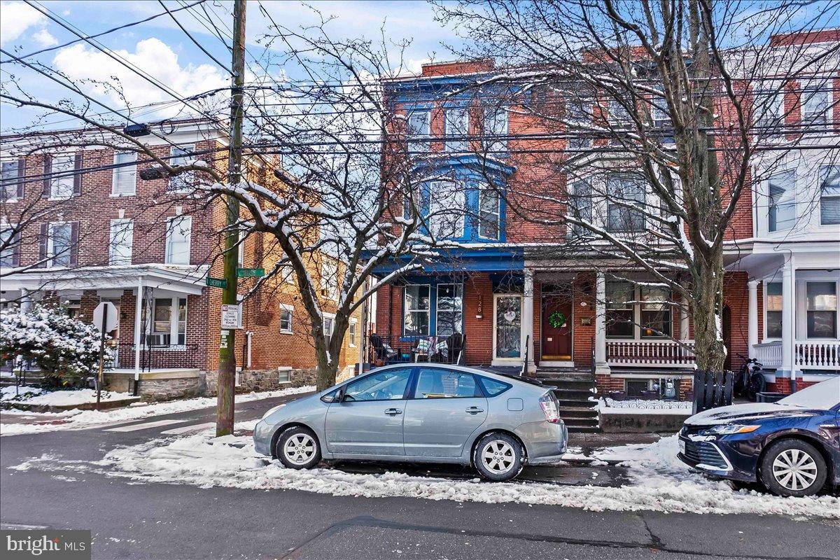 128 East Ross Street Lancaster, PA 17602 - Photo 4 of 36 a car parked in front of a big house