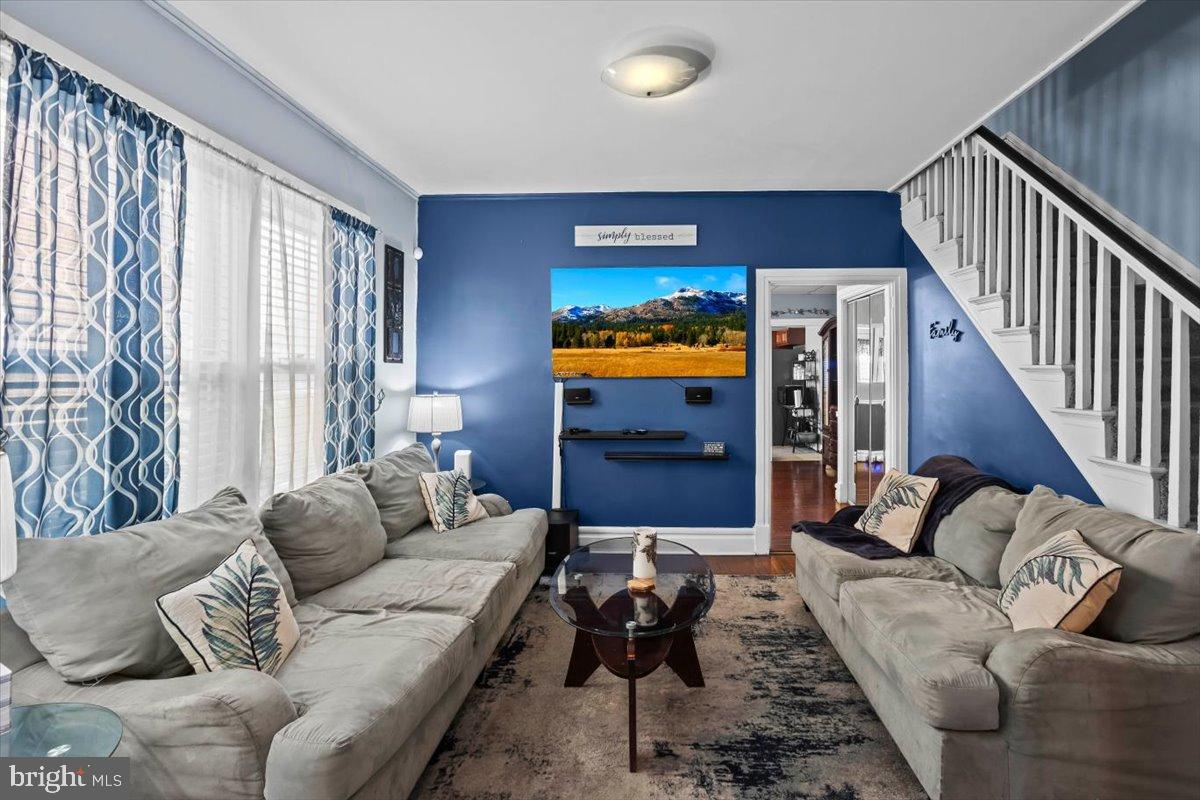 128 East Ross Street Lancaster, PA 17602 - Photo 9 of 36 a living room with furniture and a flat screen tv
