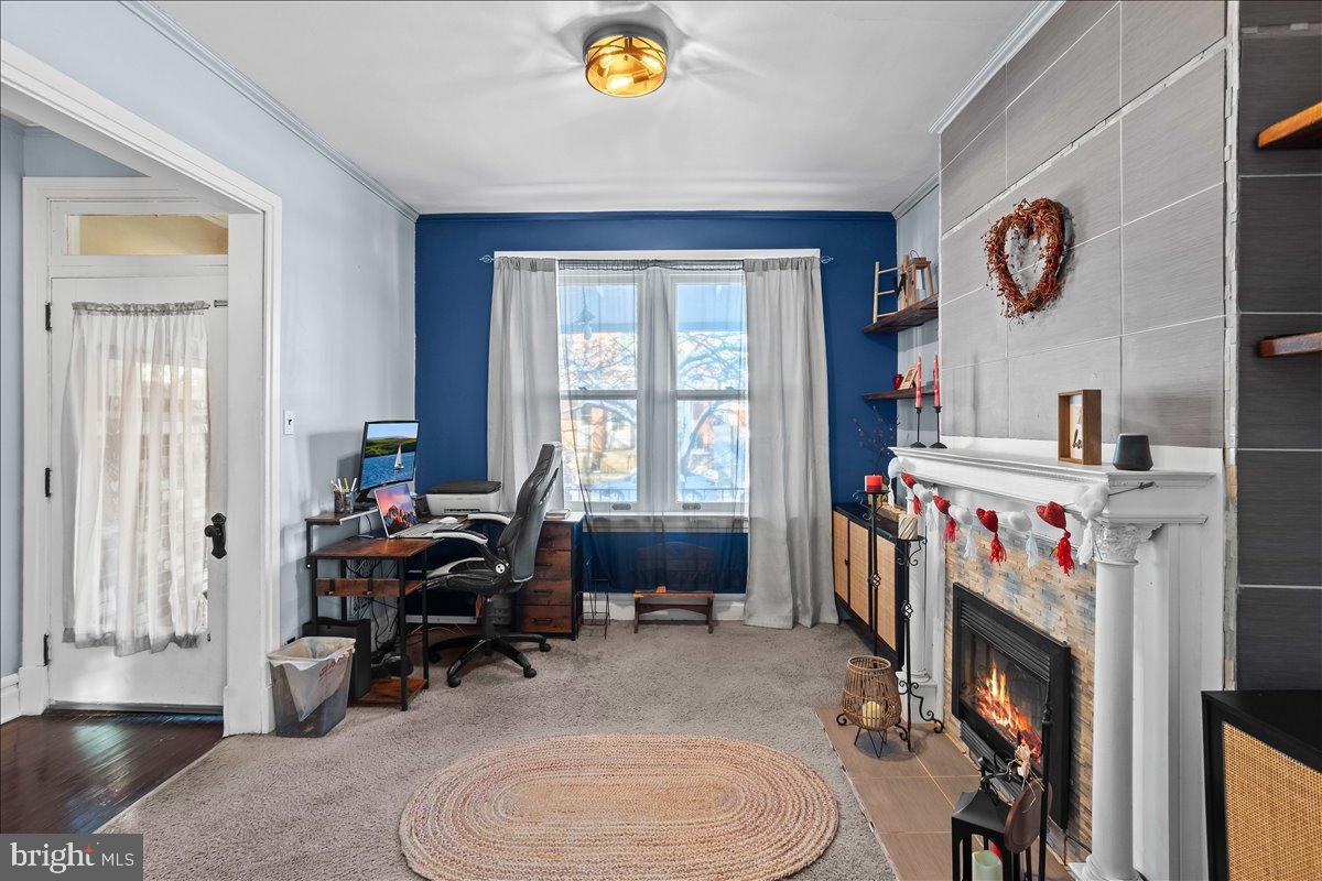 128 East Ross Street Lancaster, PA 17602 - Photo 10 of 36 a bed room with a bed a table and a large window